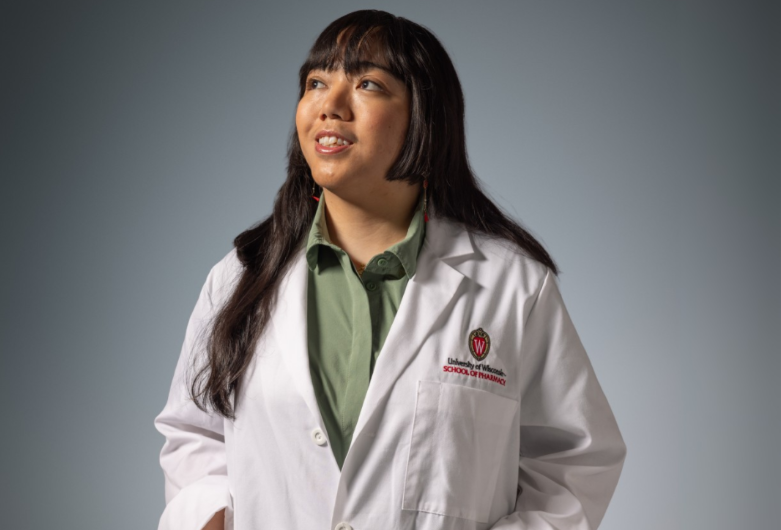PharmD student Nuelle in white coat