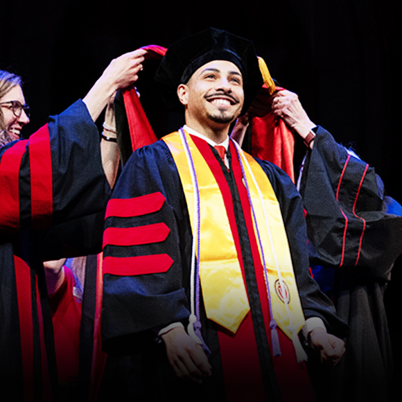 PharmD graduate at hooding ceremony